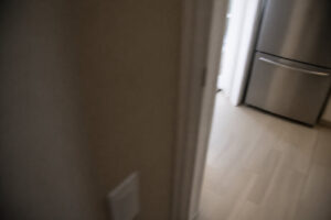 partial view of kitchen after water leak taken while walking past doorway