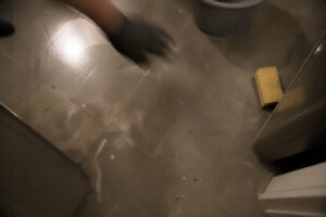 floor with residue and partial cleaning tools visible during smoke cleanup