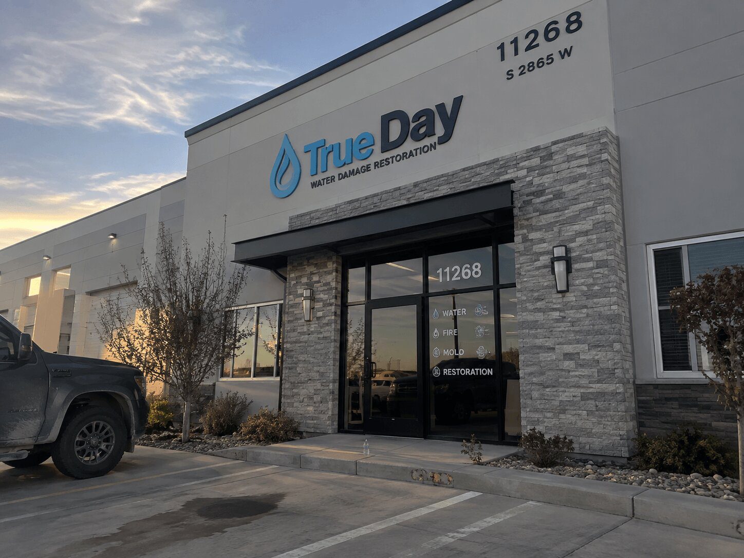 True Day water damage restoration exterior with technicians at the South Jordan office